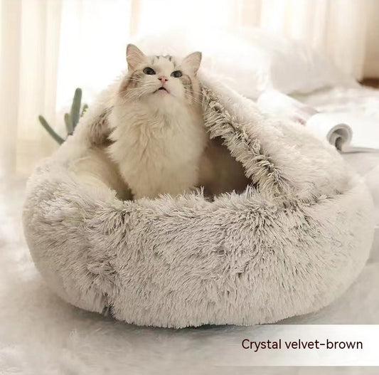 Dog curled up in round plush calming winter bed