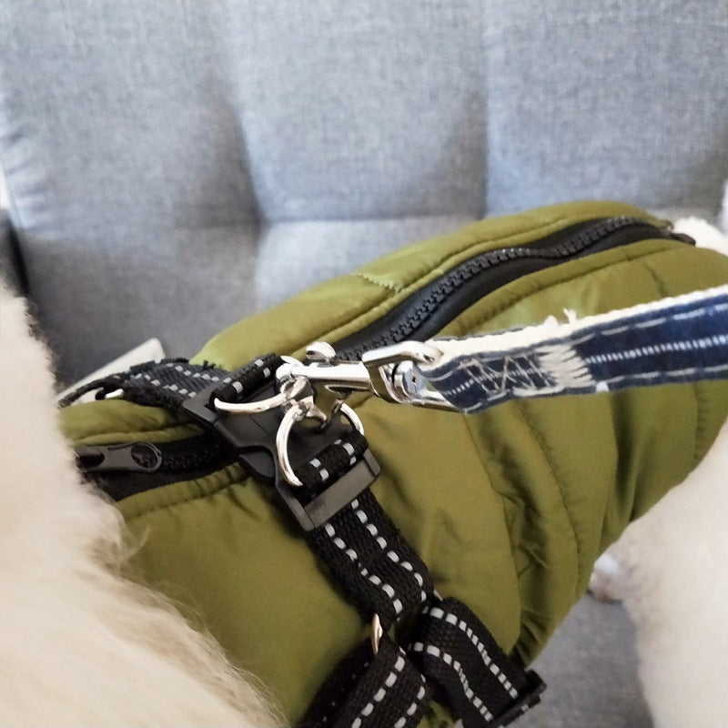 Waterproof dog coat showing built-in harness attachment ring